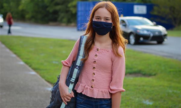 student smiles on first day of school